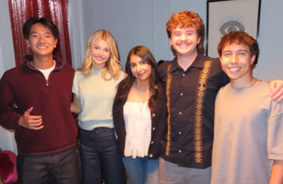 Cast group smiling